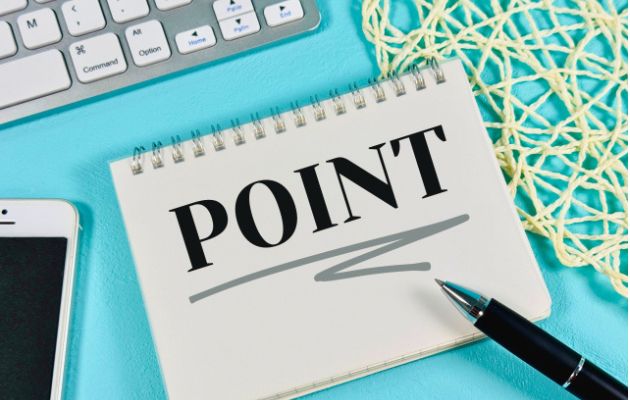 ノートに「POINT」とかかれていて、周りにキーボードや携帯電話が置いてある写真